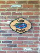 Camp sign cedar carved with canoe center image and camp name