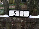 High contrast black and white easy to read house number sign