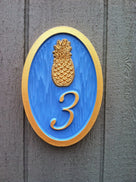 1 digit house number sign with bright blue and gold colors