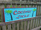 Tiki bar sign with coconut trees
