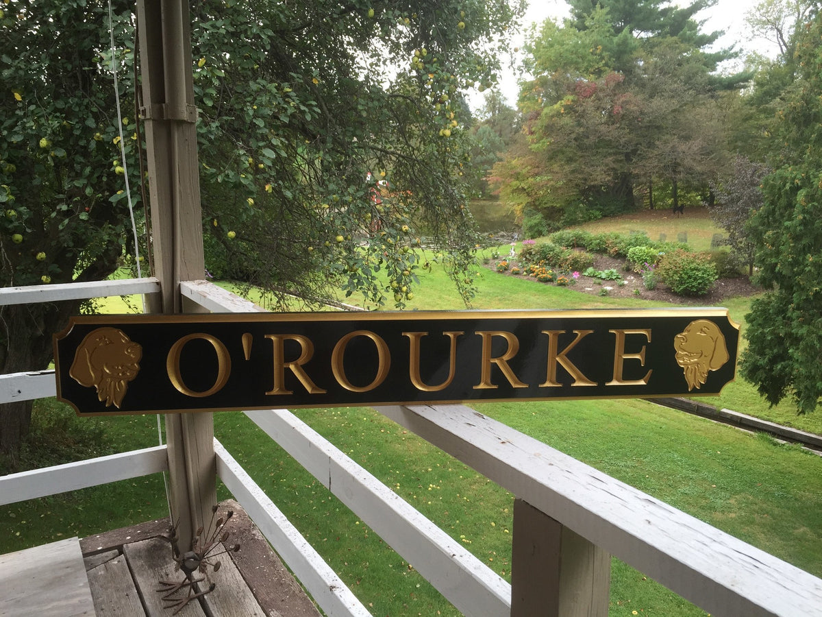Custom quarterboard with dog breed carved on it painted black and gold