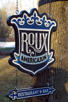 Side view of Roux restaurant sign