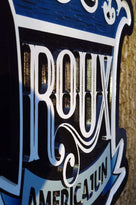 Carving from Roux restaurant sign