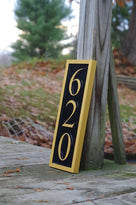 620 house number plaque in vertical position painted black and gold