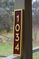 Side view of Vertical address sign with numbers 1034