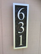 Vertical custom carved house number painted black and silver with 631