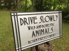 Drive slowly sign side view