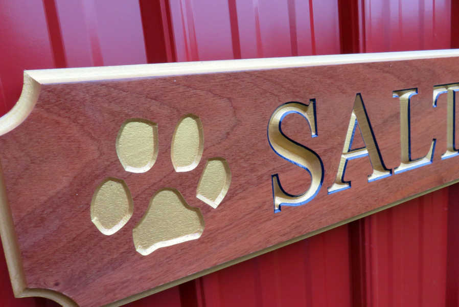 Close up of paw print carved on quarterboard