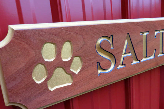 Close up of paw print carved on quarterboard
