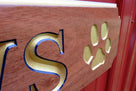 Angle view of paw print carved on quarterboard sign